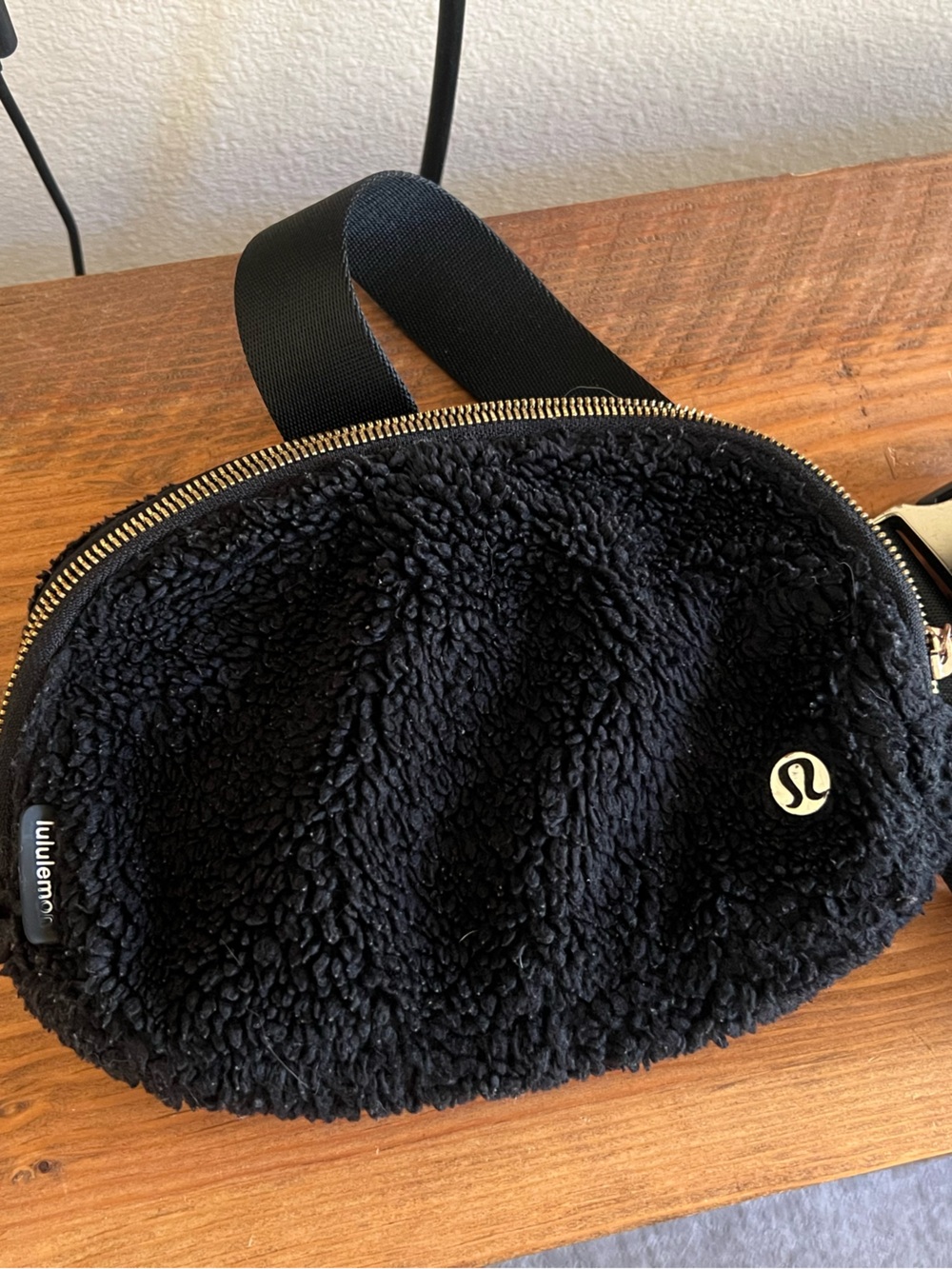 lululemon athletica black sherpa belt bag with gold hardware